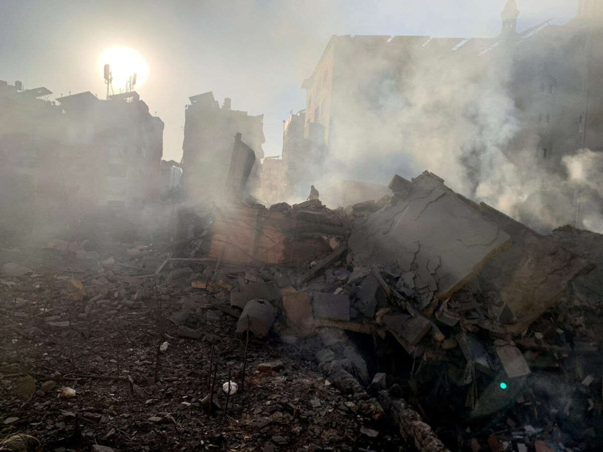 A member of the Lebanese Civil Defence inspects a destroyed building after a strike on Beirut's southern suburbs, following an escalation between Hezbollah and Israel, amid the U.S.-Israeli conflict with Iran, Lebanon, March 11, 2026. Picture taken with a mobile phone. REUTERS