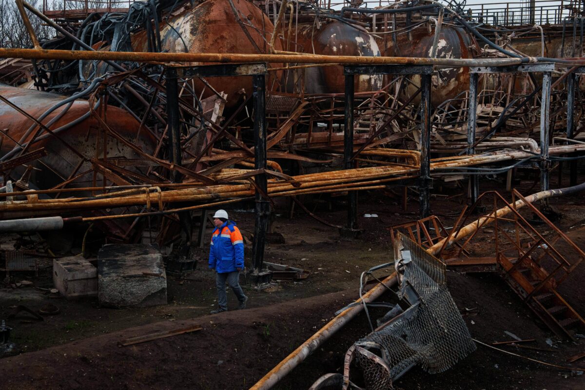 Victor, a Naftogaz worker, walks in front of a Naftogaz gas extraction facility destroyed by a Russian strike in Ukraine, on Tuesday, Nov. 18, 2025. (AP Photo/Evgeniy Maloletka)