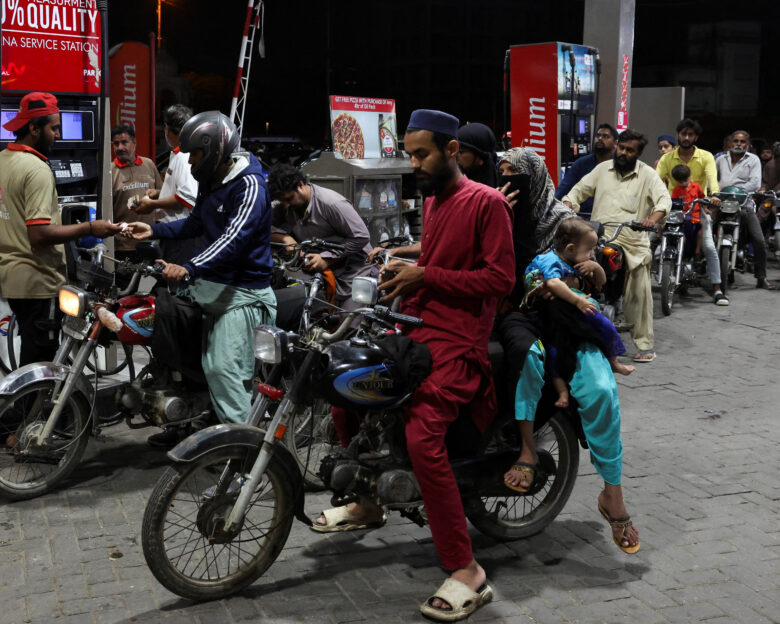 People wait for their turn to get fuel at a petrol station, amid the U.S. and Israeli conflict in Iran, in Karachi, Pakistan March 6, 2026. REUTERS/Akhtar Soomro