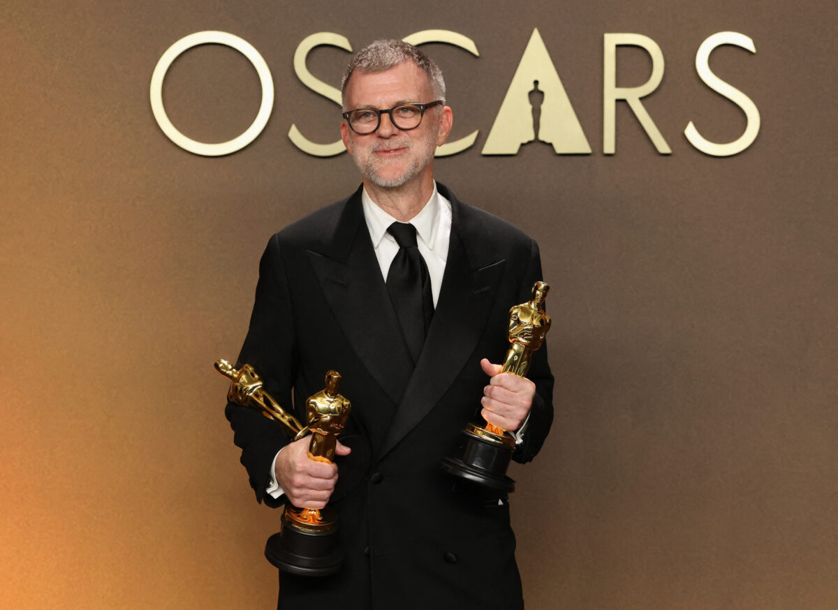 Paul Thomas Anderson poses with the Oscars he and his film "One Battle After Another" won, in the Oscars photo room at the 98th Academy Awards in Hollywood, Los Angeles, California, U.S., March 15, 2026. REUTERS/Mario Anzuoni
