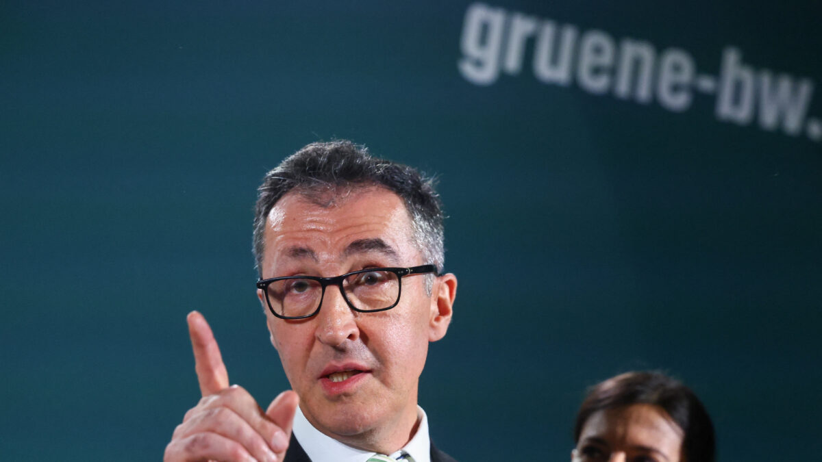 Cem Oezdemir, top candidate of the Greens party in Germany's Baden-Wuerttemberg state election, speaks next to his wife Flavia, following exit polls, in Stuttgart, Germany, March 8, 2026. REUTERS/Wolfgang Rattay