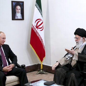 In this picture released by an official website of the office of the Iranian supreme leader, Supreme Leader Ayatollah Ali Khamenei, right, speaks with Russia's President Vladimir Putin, in Tehran, Iran, Friday, Sept. 7, 2018. A portrait of the late Iranian revolutionary founder Ayatollah Khomeini hangs on the wall. (Office of the Iranian Supreme Leader via AP)