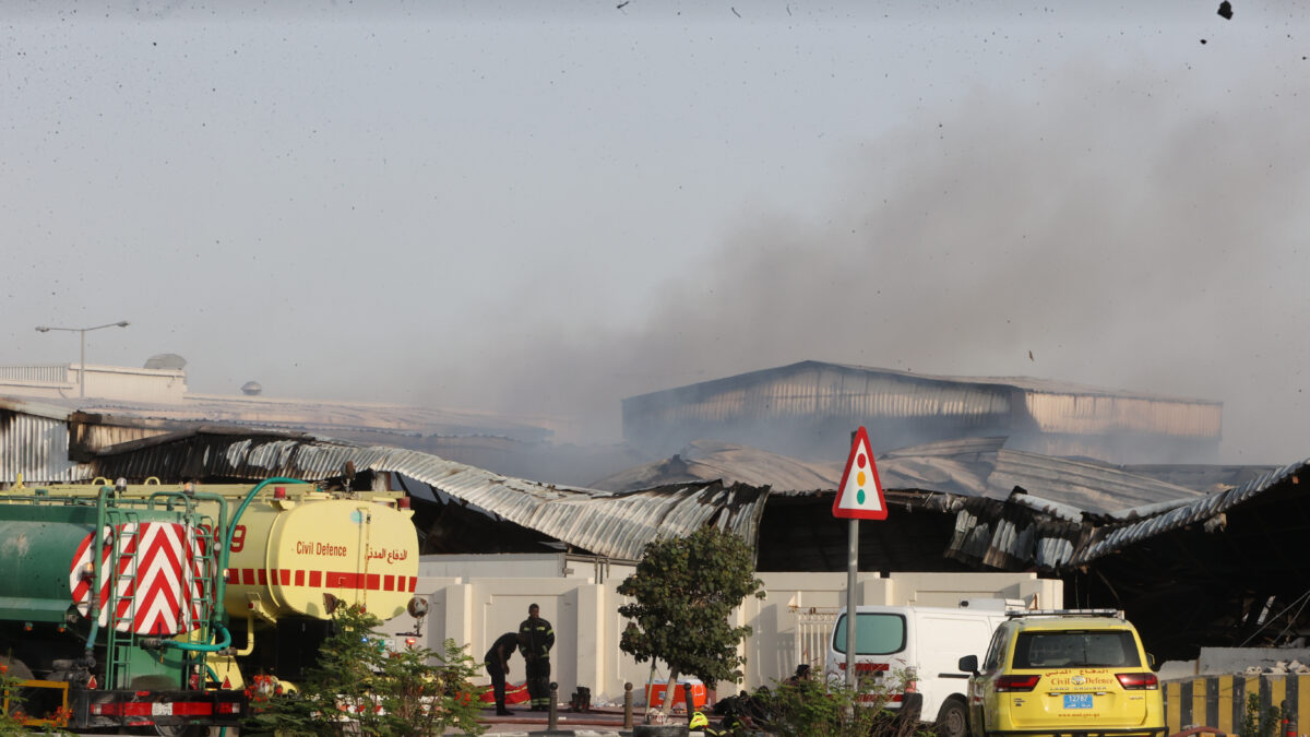 Firefighters work as smoke rises outside a damaged warehouse in an industrial area in Al Rayyan, Qatar, following an Iranian strike, Sunday, March 1, 2026. (AP Photo)