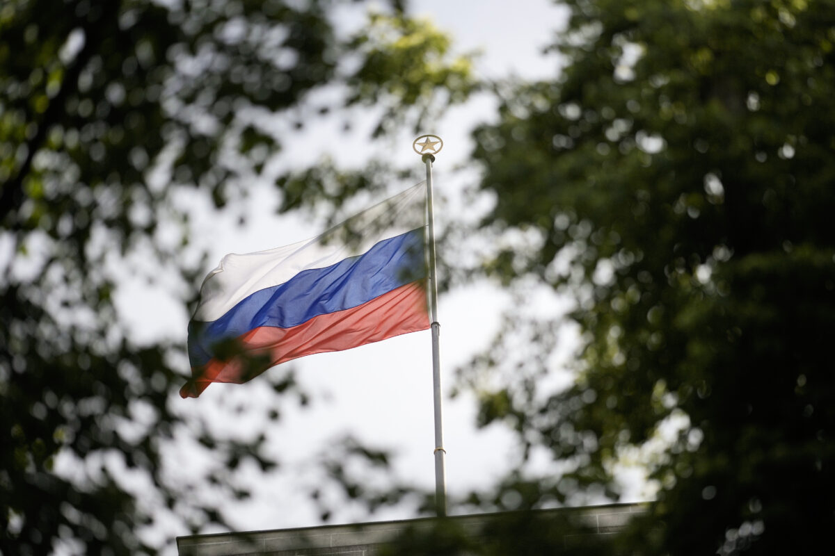 The Russian flag waves on the top of the Russian embassy in Berlin, Germany, Wednesday, May 31, 2023. Germany authorities says it has told Russia to close four out of five consulates in Germany in a tit-for-tat move after Moscow set a limit for the number of German embassy staff and related bodies that can operate in Russia. (AP Photo/Markus Schreiber)