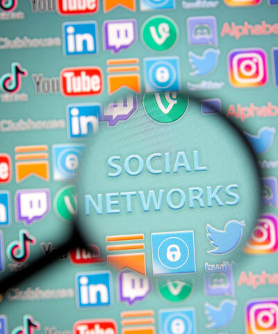 FILE PHOTO: Social network words and social media logos are seen through magnifier displayed in this illustration taken, May 25, 2021. Picture taken May 25, 2021. REUTERS/Dado Ruvic/Illustration/File Photo