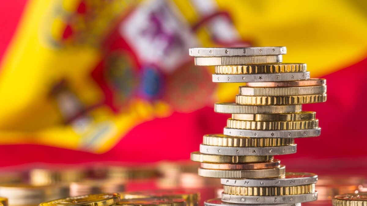 National flag of spain and euro coins - concept. Euro coins. Euro money. Euro currency.