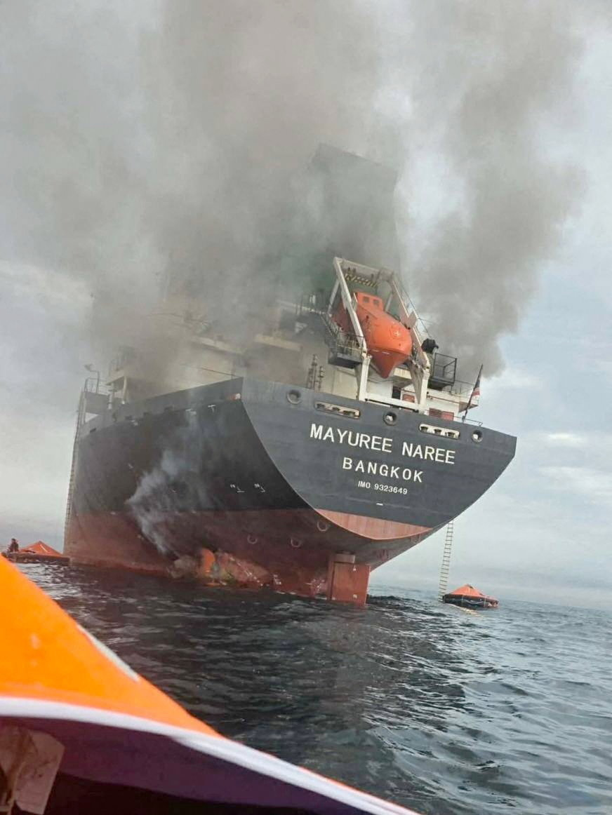 The Thailand-flagged cargo ship Mayuree Naree engulfed in black smoke in the Strait of Hormuz, March 11, 2026. ROYAL THAI NAVY