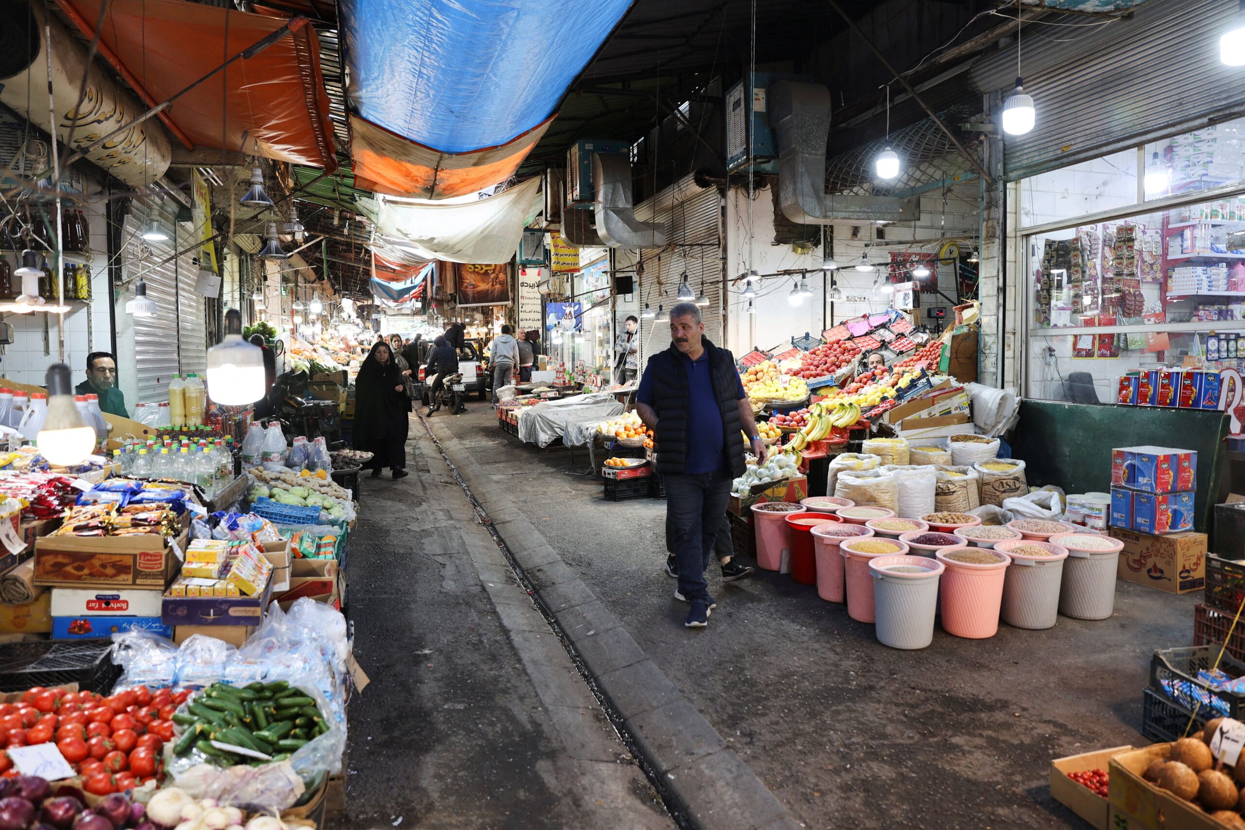 People shop at a market, in Tehran People walk through a market, amid the U.S.-Israeli conflict with Iran, in Tehran, Iran, March 5, 2026. Majid Asgaripour/WANA (West Asia News Agency) via REUTERS ATTENTION EDITORS - THIS PICTURE WAS PROVIDED BY A THIRD PARTY