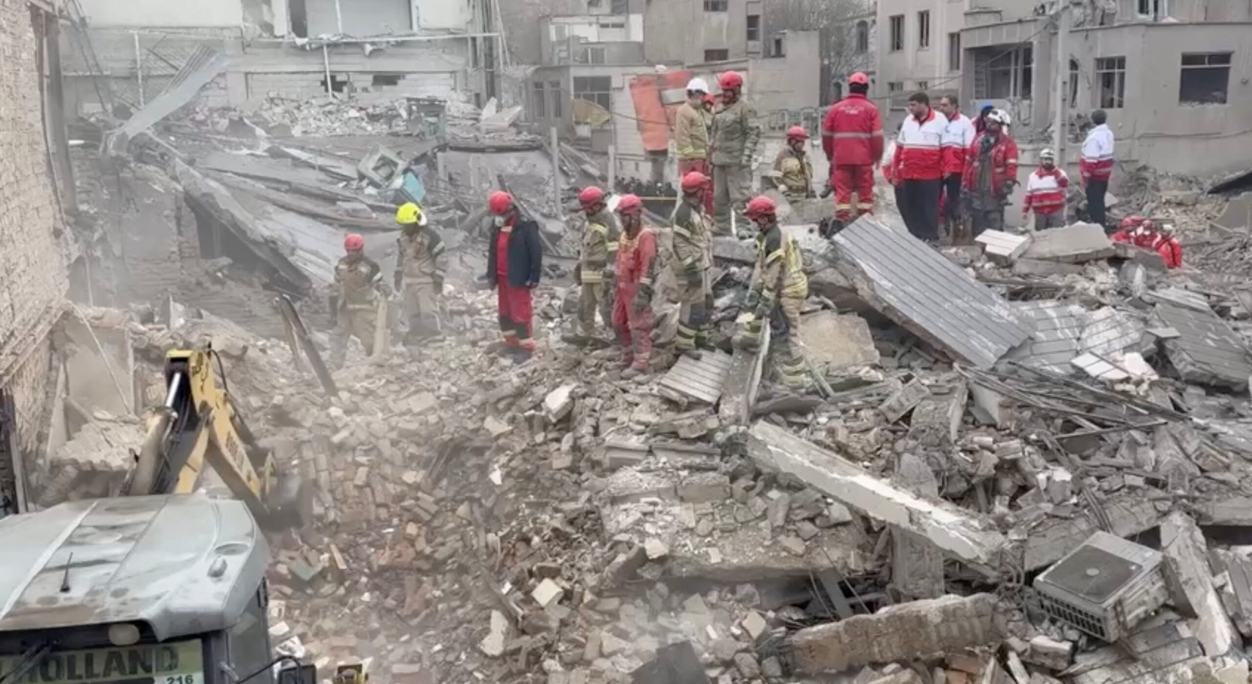 Aftermath of strike in Javadiyeh district, Tehran Iranian Red Crescent aid workers and firefighters work at a residential site damaged by strikes, in Javadiyeh district, Tehran, Iran, in this still image obtained from a video released March 14, 2026. Iranian Red Crescent Society/Handout via REUTERS THIS IMAGE HAS BEEN SUPPLIED BY A THIRD PARTY. NO RESALES. NO ARCHIVES. MANDATORY CREDIT. VERIFICATION: Reuters confirmed the location as Javadiyeh district, Tehran by the buildings, road layout, and highway divider which matched file and satellite imagery and another video verified by Reuters. Coordinates: 35.647908748581706, 51.395776192302044. The date when the video was recorded could not be independently verified, but local Iranian media reported that residential neighbourhoods of Beryanak and Javadiyeh in southeastern Tehran were struck by the United States and Israel during marches on March 13.