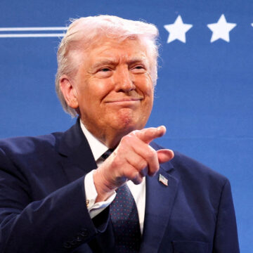 U.S. President Donald Trump gestures from the stage next to U.S. Representative Steve Scalise (R-LA) at Trump National Doral Miami in Miami, Florida, U.S., March 9, 2026. REUTERS/Kevin Lamarque TPX IMAGES OF THE DAY