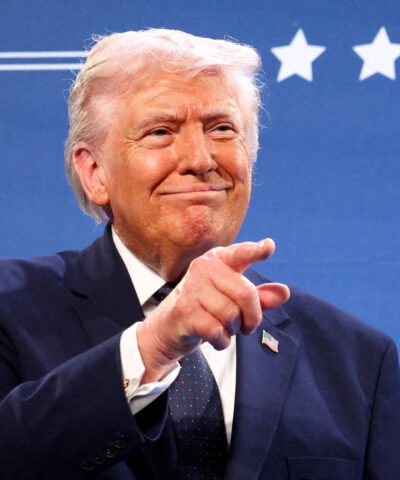 U.S. President Donald Trump gestures from the stage next to U.S. Representative Steve Scalise (R-LA) at Trump National Doral Miami in Miami, Florida, U.S., March 9, 2026. REUTERS/Kevin Lamarque TPX IMAGES OF THE DAY
