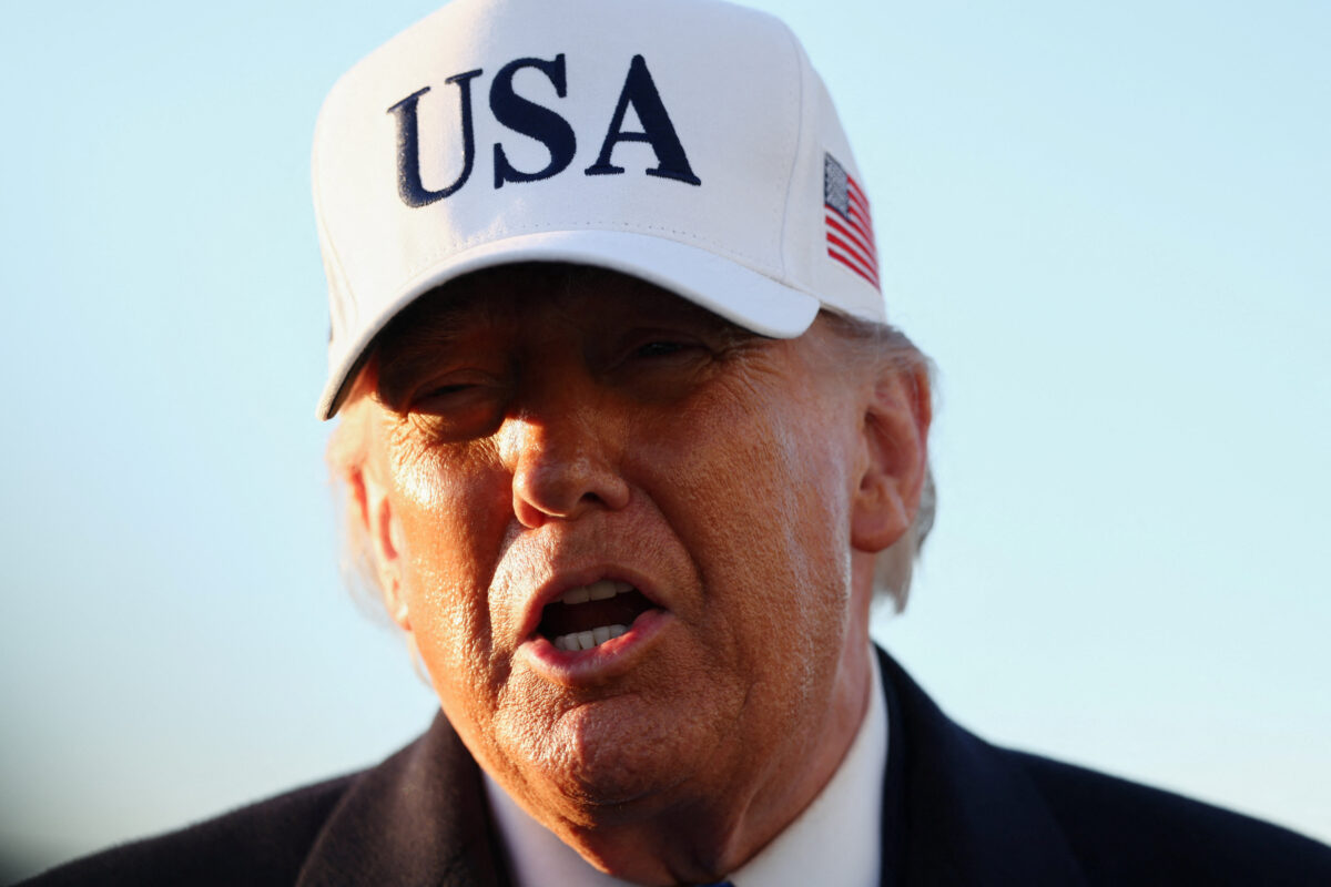 U.S. President Donald Trump speaks to members of the media before boarding Air Force One for travel to Florida, at Joint Base Andrews, Maryland, U.S., March 13, 2026. REUTERS/Kevin Lamarque