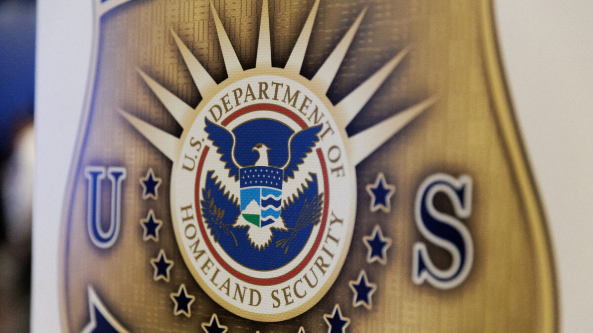 FILE PHOTO: The seal of the U.S. Department of Homeland Security is printed on a sign during a U.S. Immigration and Customs Enforcement (ICE) two-day job fair in Texas to help fill vacancies for deportation officers and attorneys, in Arlington, Texas, U.S. August 26, 2025. REUTERS/Shelby Tauber/File Photo
