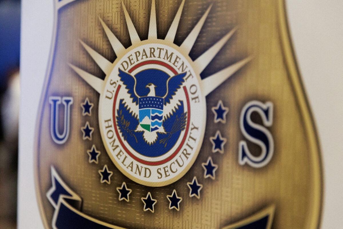 FILE PHOTO: The seal of the U.S. Department of Homeland Security is printed on a sign during a U.S. Immigration and Customs Enforcement (ICE) two-day job fair in Texas to help fill vacancies for deportation officers and attorneys, in Arlington, Texas, U.S. August 26, 2025. REUTERS/Shelby Tauber/File Photo