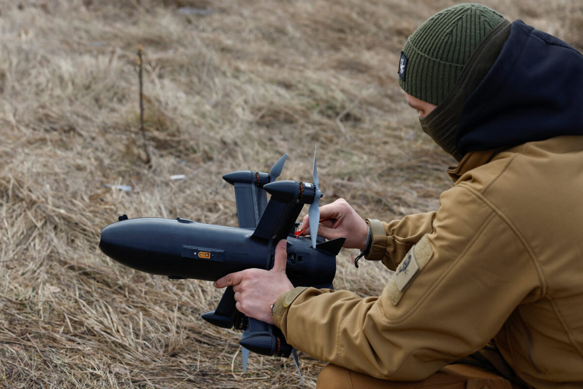 An employee checks P1-Sun FPV interceptor drone before flying it at a training ground during an examination for military drone operators of the SkyFall fly academy, amid Russia's attack on Ukraine, in an undisclosed location, Ukraine March 6, 2026. REUTERS/Valentyn Ogirenko