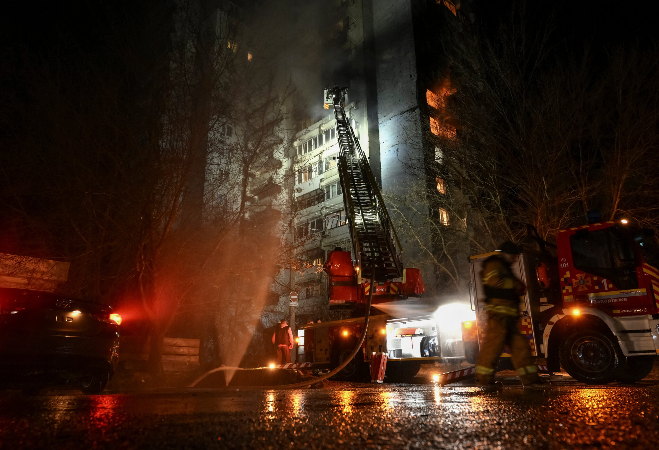Firefighters work at the site of an apartment building hit by a Russian drone strike, amid Russia's attack on Ukraine, in Zaporizhzhia, Ukraine March 24, 2026. REUTERS/Stringer