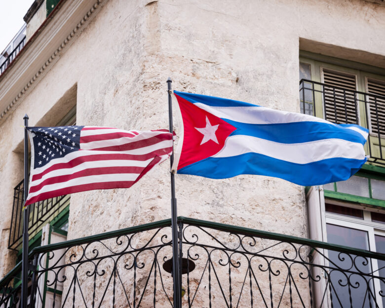 US and Cuban flags side by side in Havana, Cuba