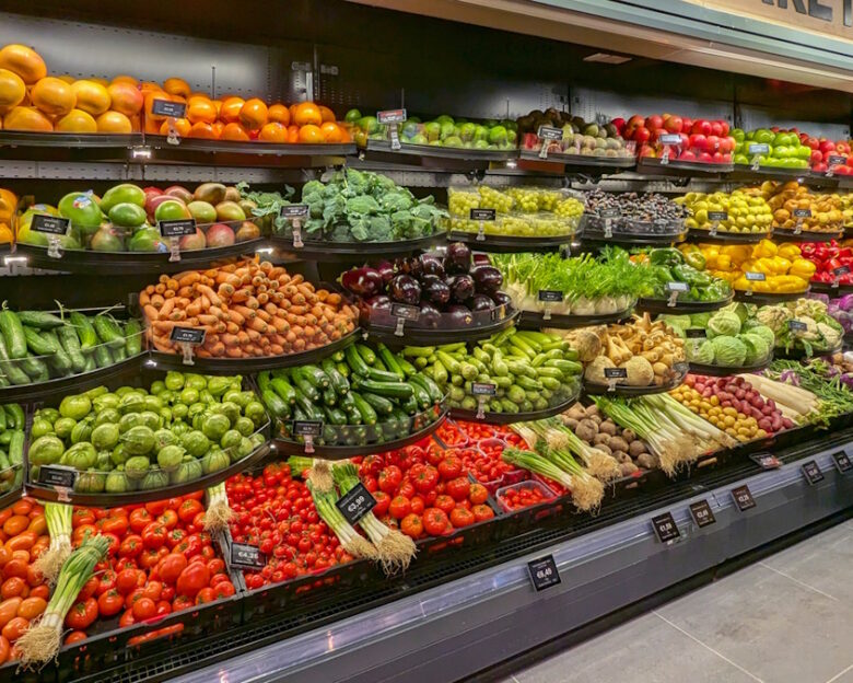 Assortment of vibrant fresh fruits and vegetables in grocery store fresh Fruits and Vegetables section