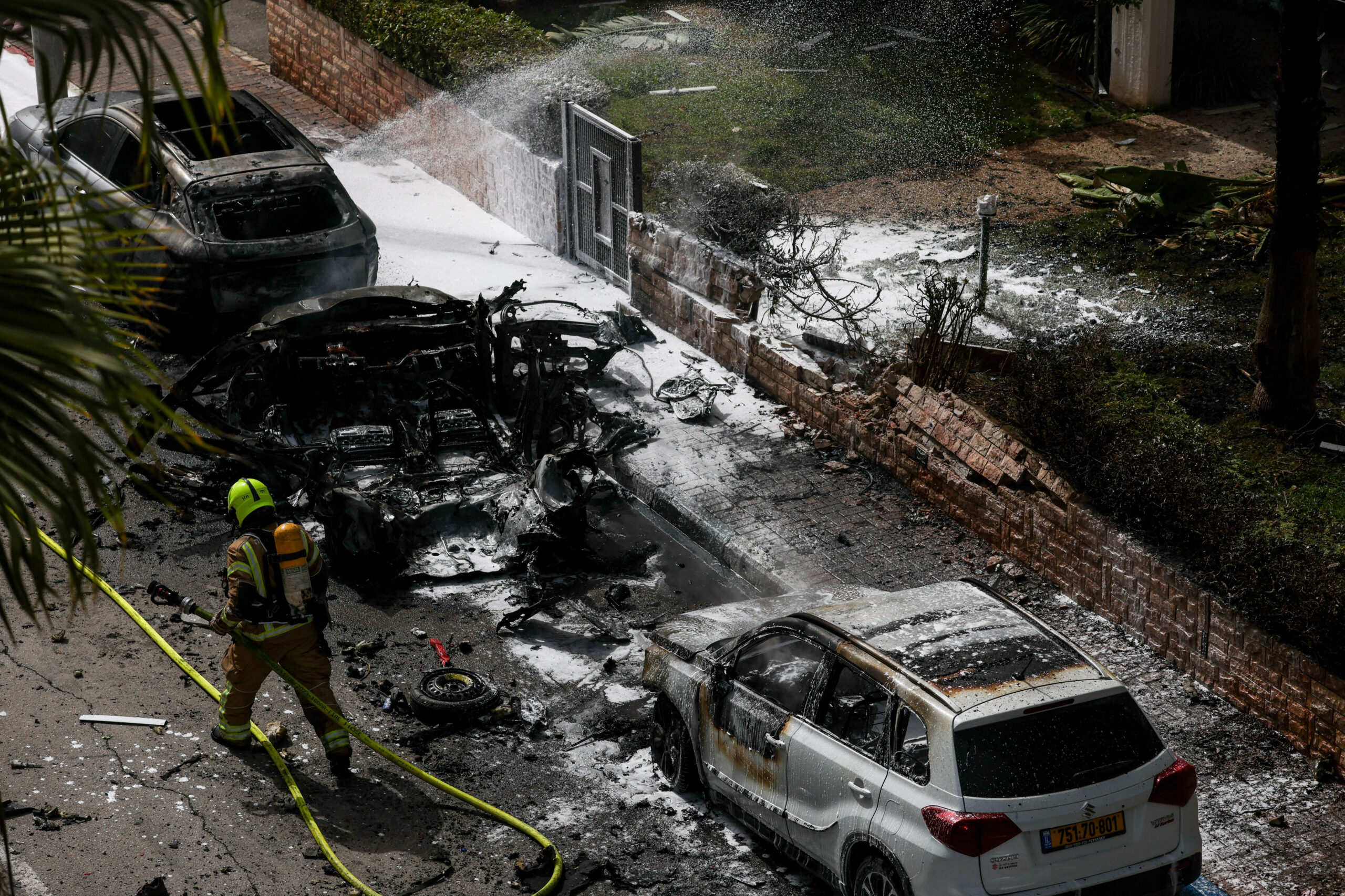 Aftermath of a missile strike in central Israel An emergency responder works at an impact site, following a barrage of missiles launched from Iran, amid the U.S.-Israeli conflict with Iran, in central Israel, April 4, 2026. REUTERS/Florion Goga