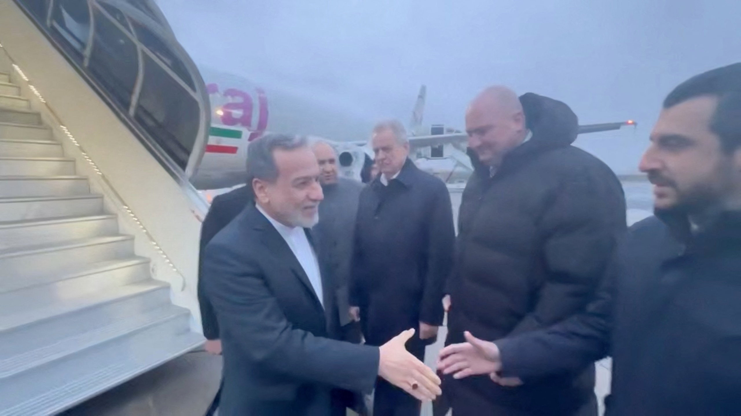 Iran's Foreign Affairs Minister Abbas Araqchi is greeted by officials, according to Iran's media, during his visit to Russia for talks with Russian President Vladimir Putin, in a place given as St. Petersburg, Russia, in this screenshot from a video released on April 27, 2026. Seyed Abbas Araghchi via Telegram/Handout via REUTERS THIS IMAGE HAS BEEN SUPPLIED BY A THIRD PARTY. MANDATORY CREDIT.NO RESALES. NO ARCHIVES. VERIFICATION: Reuters could not confirm the date and location. No older versions of the video were found posted online before April 27. Iranian media reported that Iranian Foreign Minister Abbas Araqchi arrived in Russia for talks with Putin