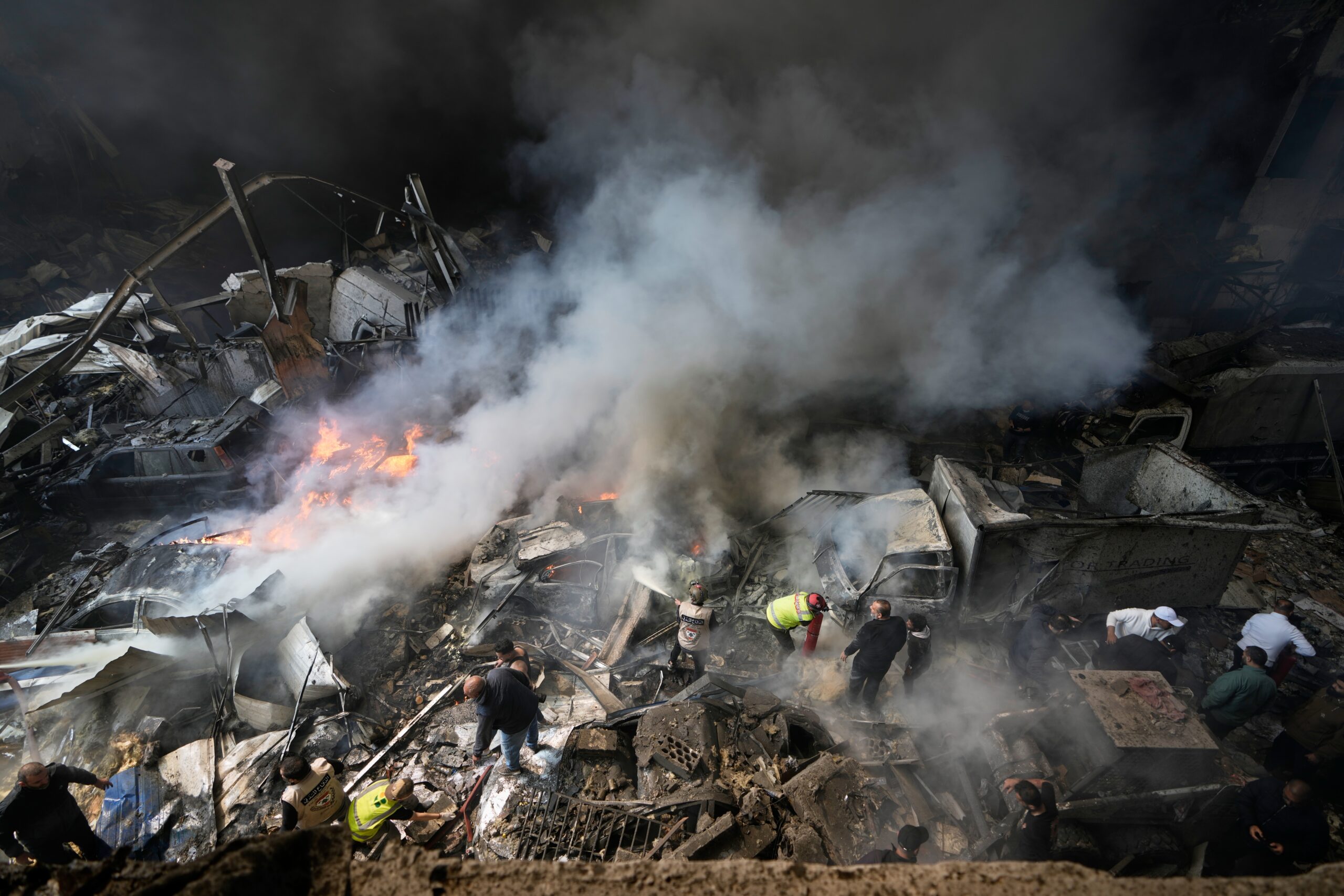 Lebanon Israel Iran War First responders search at the site of an Israeli airstrike that struck an apartment building in Beirut, Lebanon, Wednesday, April 8, 2026. (AP Photo/Bilal Hussein)