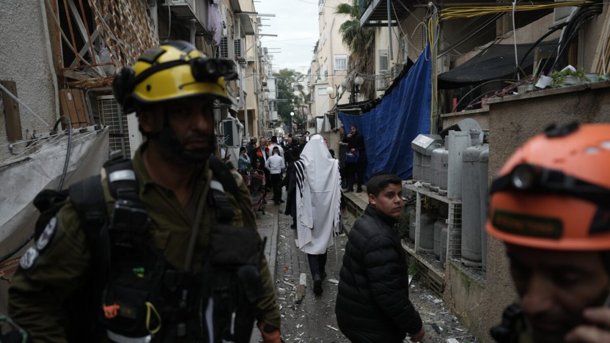 Israel's rescue teams inspect a site struck by an Iranian missile in Bnei Brak, Wednesday, April 1, 2026. (AP Photo
