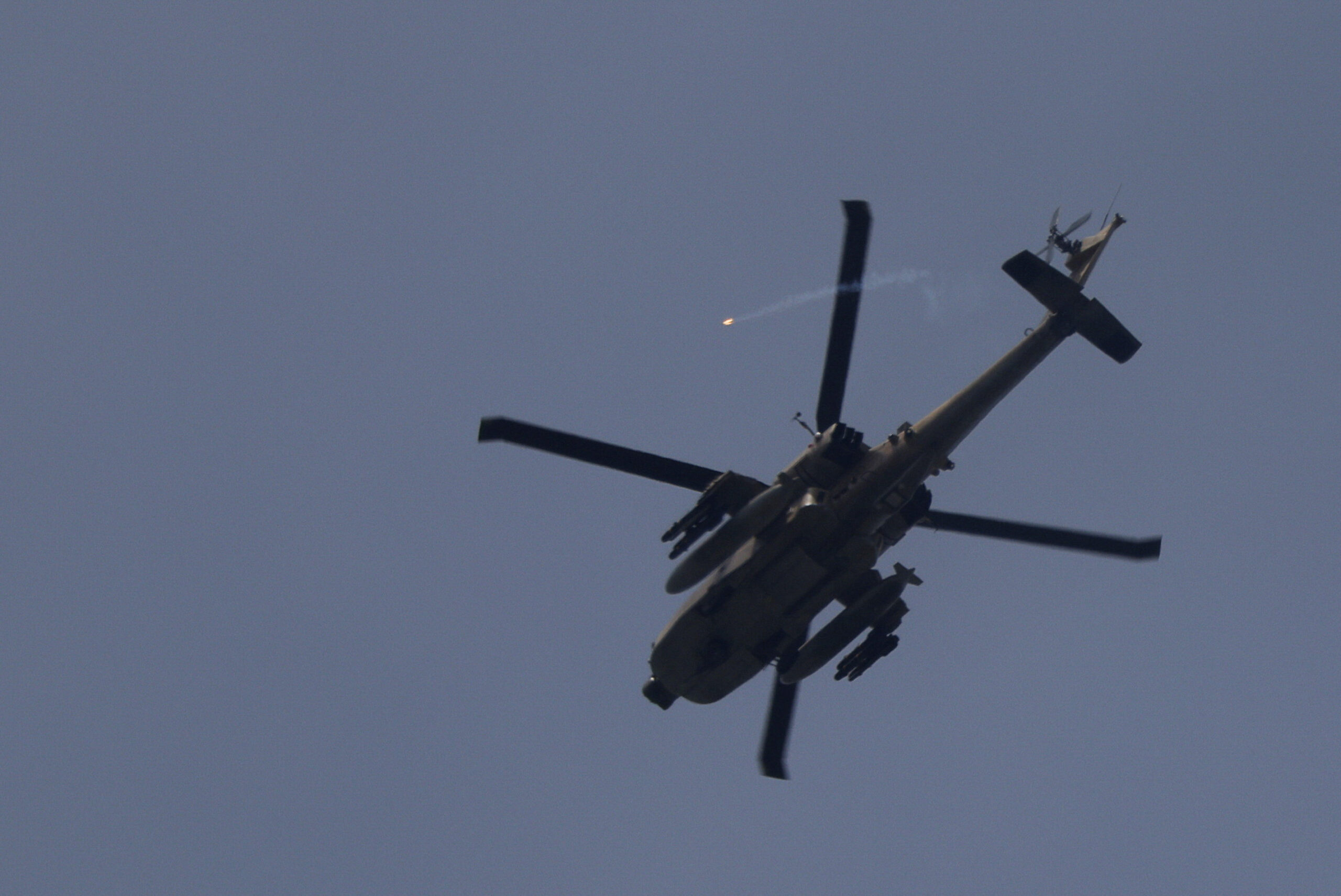 An Israeli helicopter releases a flare while flying over southern Lebanon, as seen from northern Israel An Israeli helicopter releases a flare while flying over southern Lebanon, near the Israel-Lebanon border, as seen from the Israeli side of the border in northern Israel, April 14, 2026. REUTERS/Florion Goga