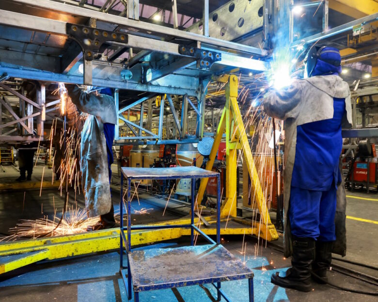 Workers operate on the bus body production line at the factory of Marcopolo, one of the world’s largest bus manufacturers with operations across multiple continents, in Caxias do Sul, Brazil, March 25, 2026. REUTERS/Diego Vara