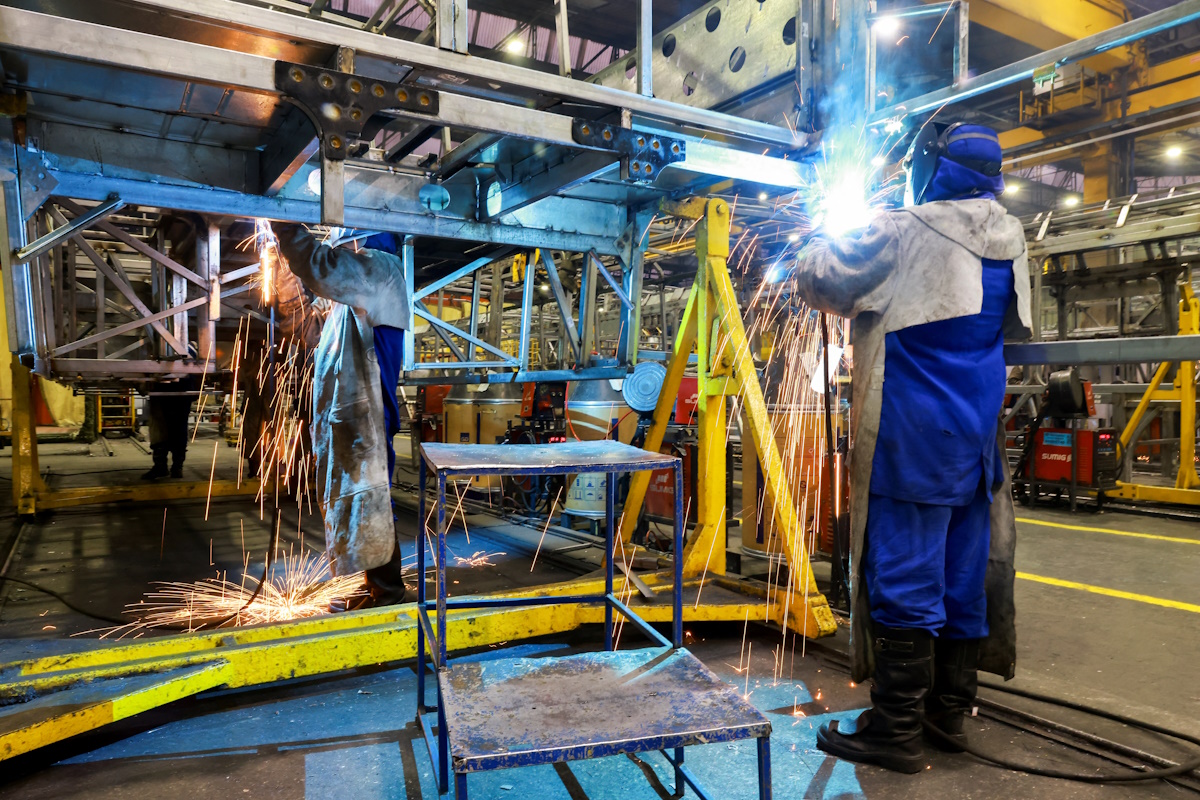 Workers operate on the bus body production line at the factory of Marcopolo, one of the world’s largest bus manufacturers with operations across multiple continents, in Caxias do Sul, Brazil, March 25, 2026. REUTERS/Diego Vara