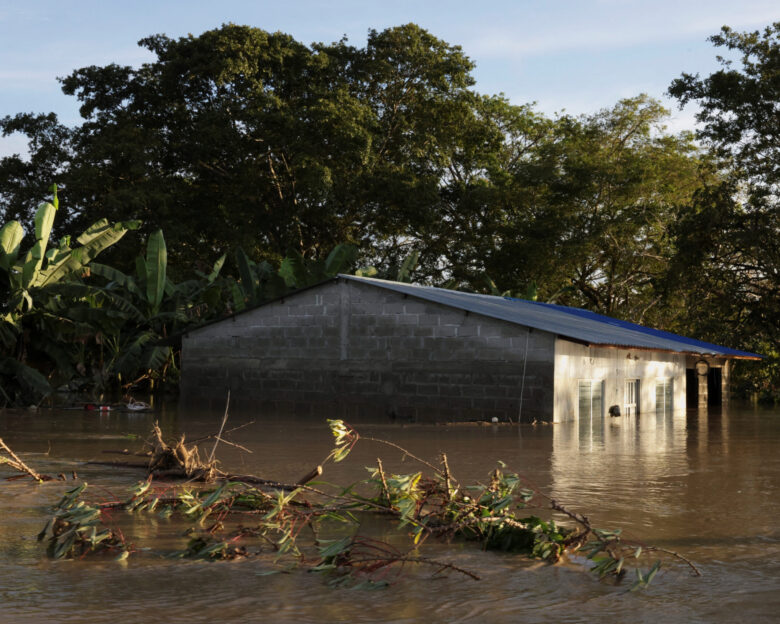 A house almost submerged in water is seen after floods caused by rains from a cold front in the northern hemisphere in Torno Rojo, Colombia, February 3, 2026. REUTERS/Luis Felipe Osorio