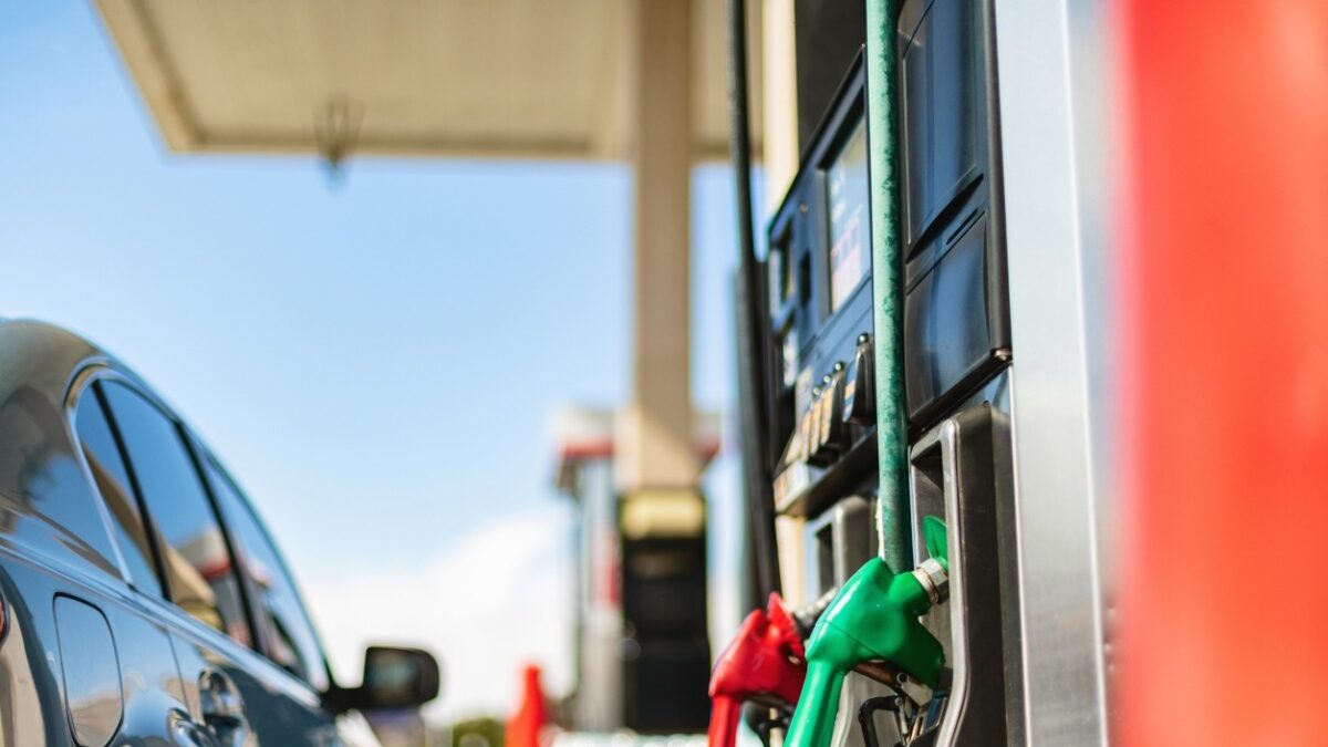 Western USA Economy and Inflation Filling Gas Tank Viewing Sales Price at The Pump Photo Series