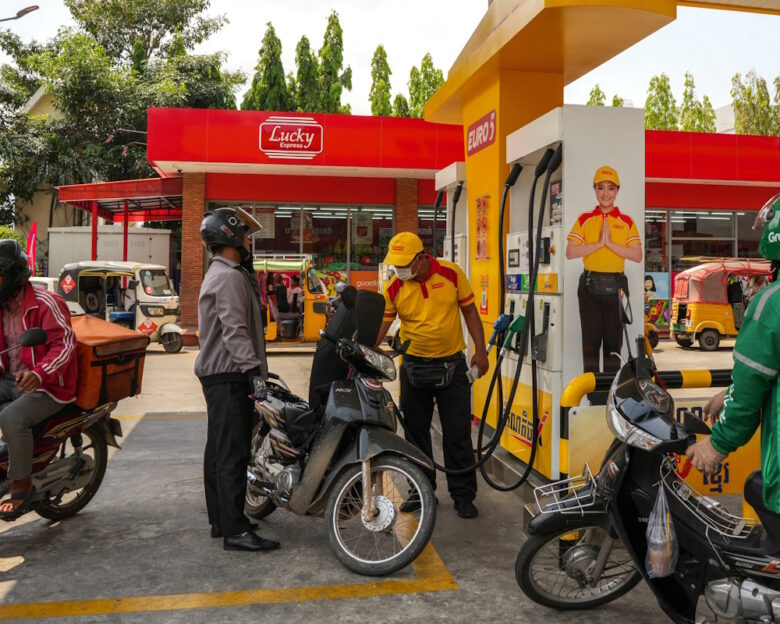 People wait to fill their vehicles with LPG and gasoline at a gas station amid the U.S.-Israeli conflict with Iran, in Phnom Penh, Cambodia, March 24, 2026. REUTERS/Roun Ry