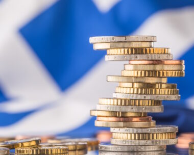 National flag of greece and euro coins - concept. Euro coins. Euro money. Euro currency.