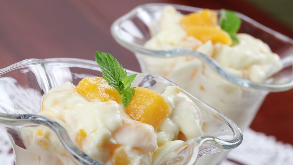 Refreshing yogurt dessert with peaches and mint.