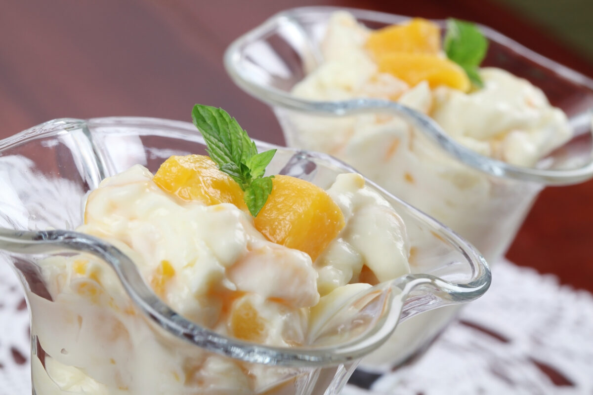 Refreshing yogurt dessert with peaches and mint.
