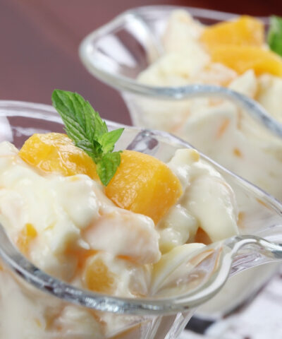 Refreshing yogurt dessert with peaches and mint.