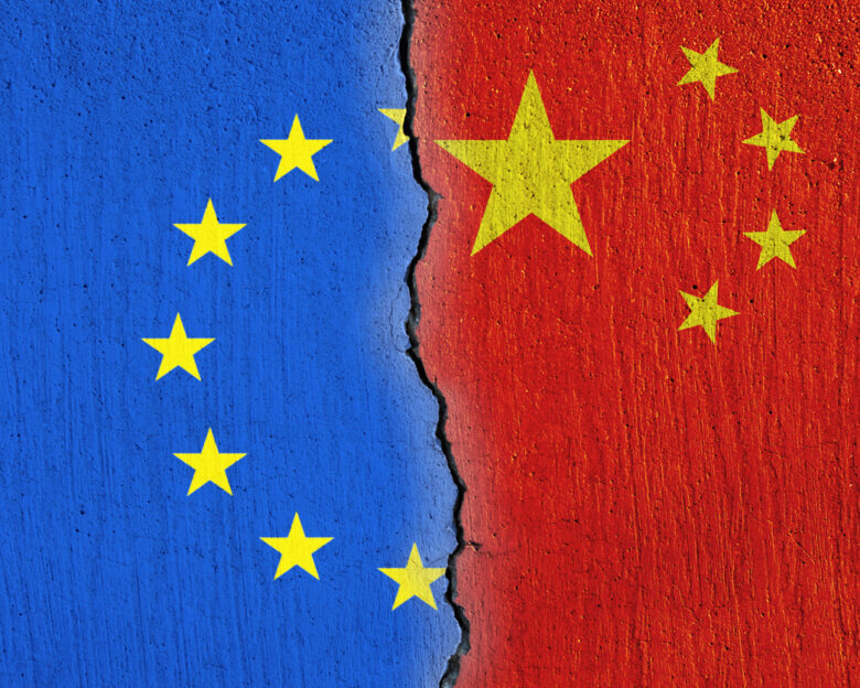 European Union flag and Chinese flag painted on cracked wall , EU and China relations