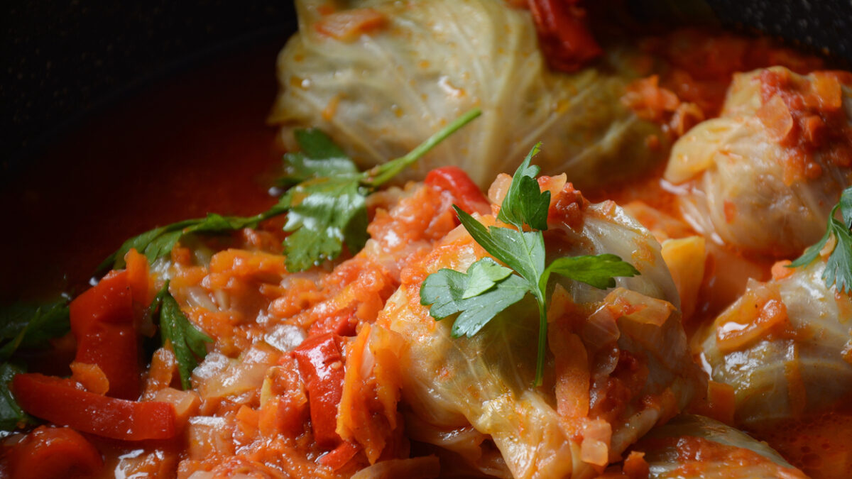 Cabbage rolls stuffed with ground beef and rice in tomato sauce