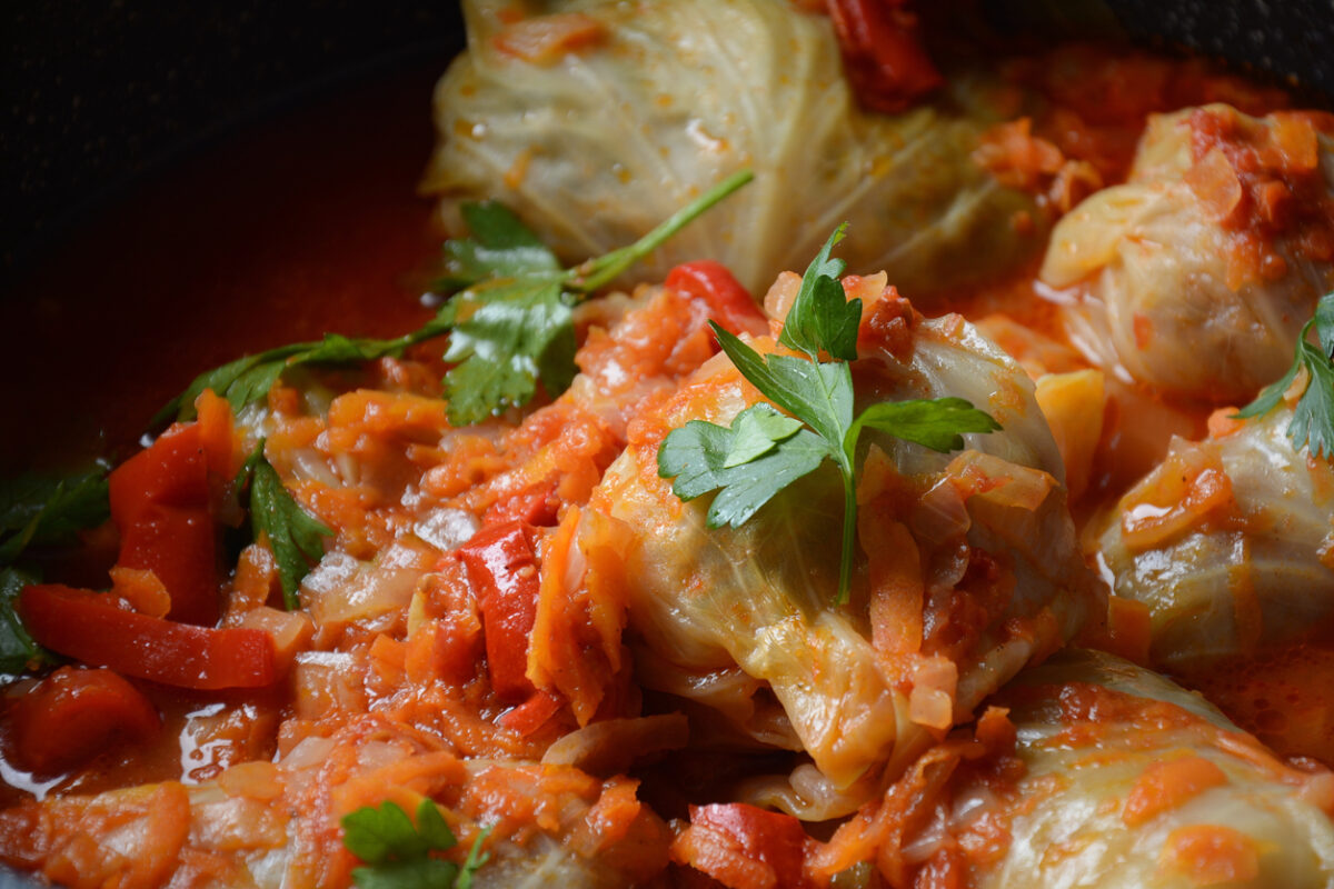 Cabbage rolls stuffed with ground beef and rice in tomato sauce