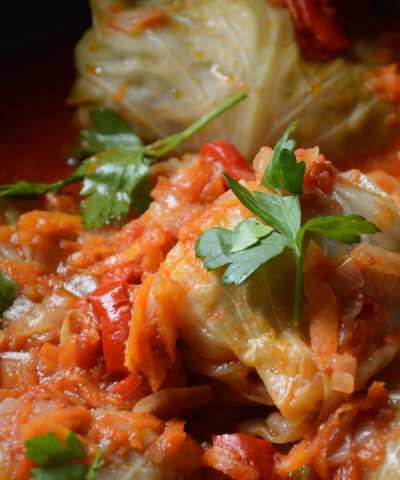 Cabbage rolls stuffed with ground beef and rice in tomato sauce