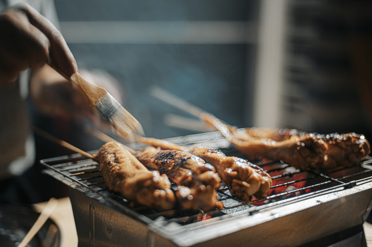 a night bbq party gathering with food preparation