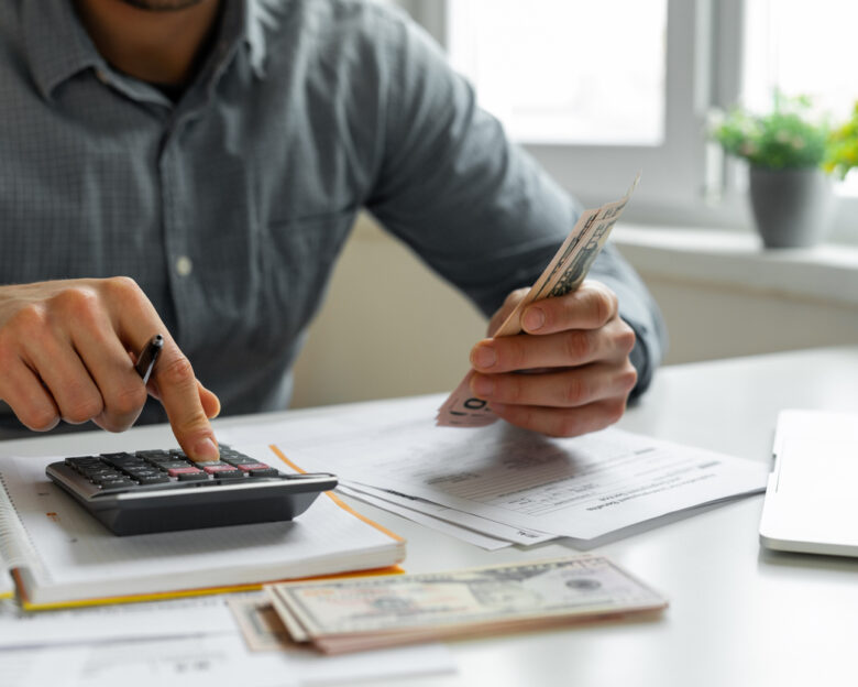 Man using calculator