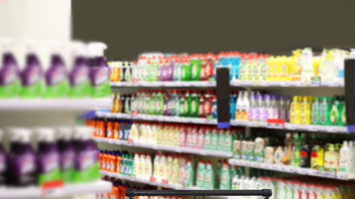 choosing detergents, toilet paper in supermarket.empty grocery cart in an empty supermarket