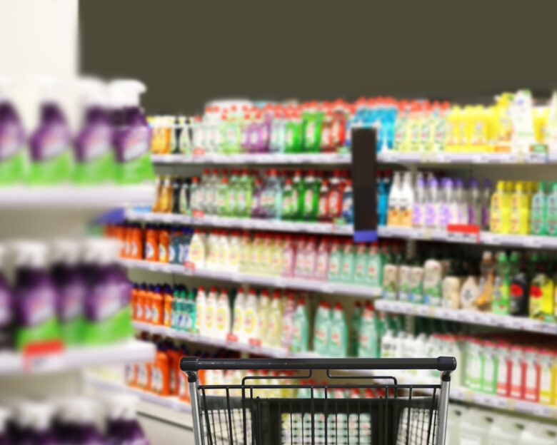 choosing detergents, toilet paper in supermarket.empty grocery cart in an empty supermarket