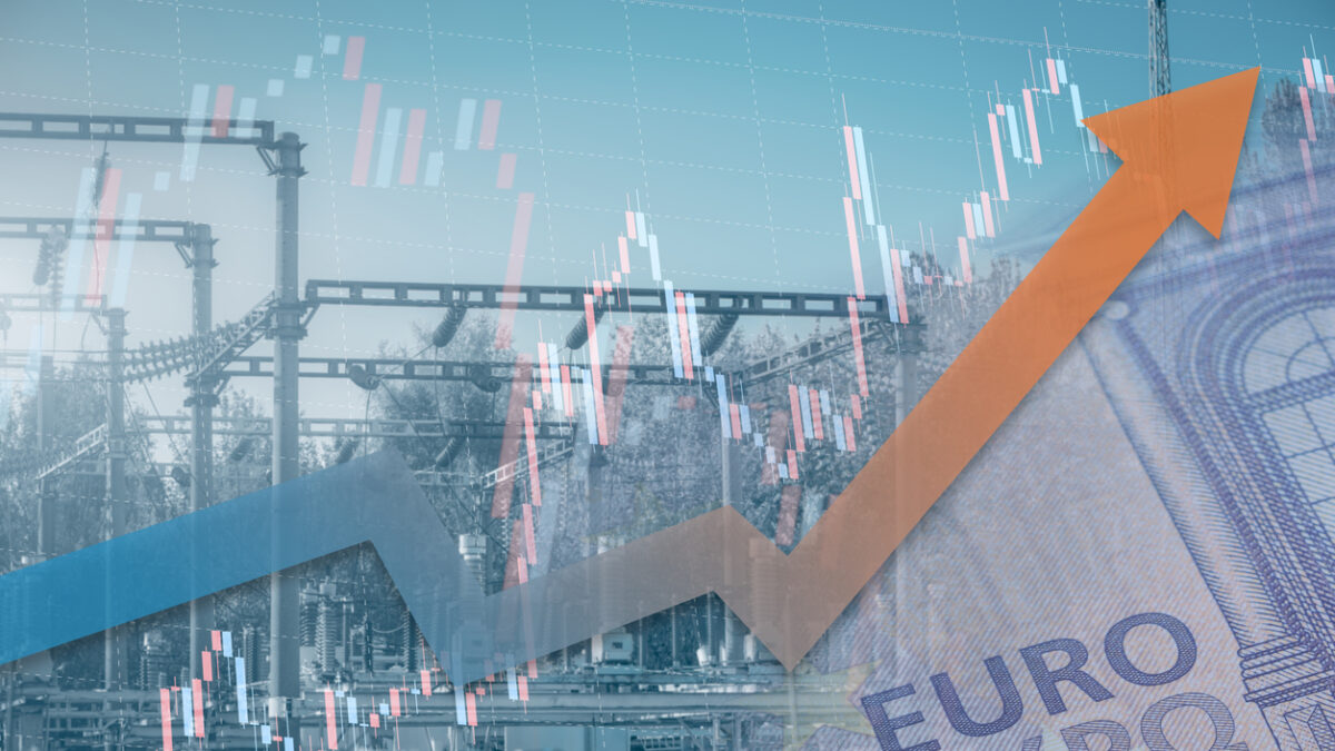 Stock chart with rising up arrow and blurred power station at background. Energy crisis in Europe. Price increase of electricity for home heating and industry