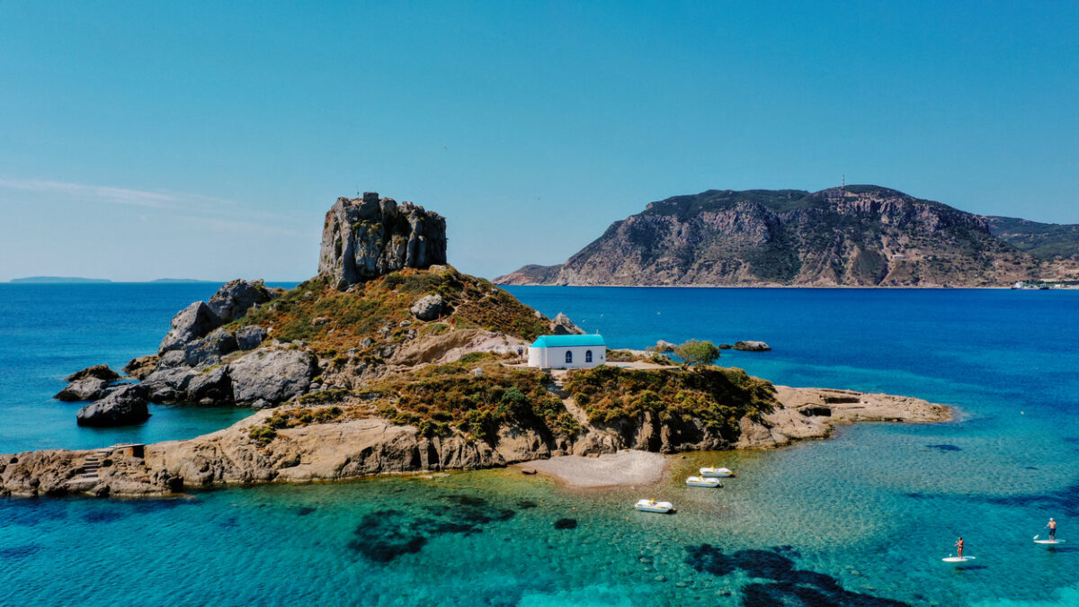 A natural view of the Kos Island and Kefalos Beach in Greece under a clear sunny sky