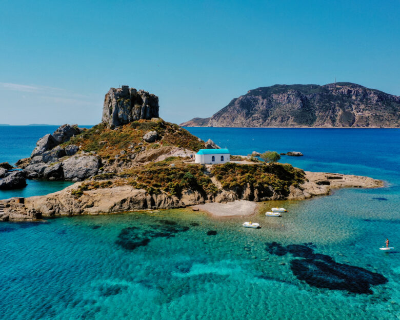 A natural view of the Kos Island and Kefalos Beach in Greece under a clear sunny sky