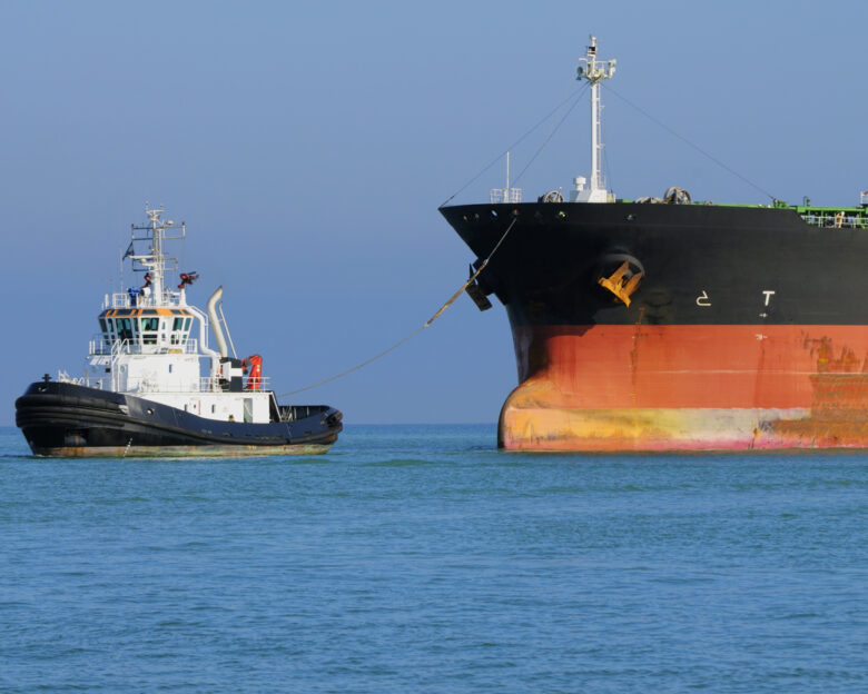 Industrial ship and tugboat