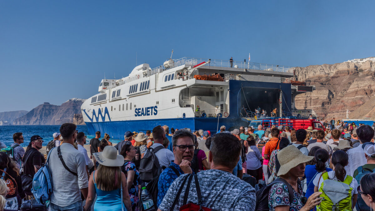 Santorini, Greece - September 4th 2023: Tourists from all over the world arrive or depart from the port of Thira