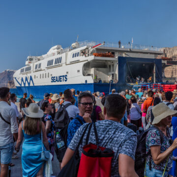 Santorini, Greece - September 4th 2023: Tourists from all over the world arrive or depart from the port of Thira